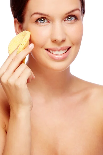 Woman purifying face with sponge — Stock Photo, Image