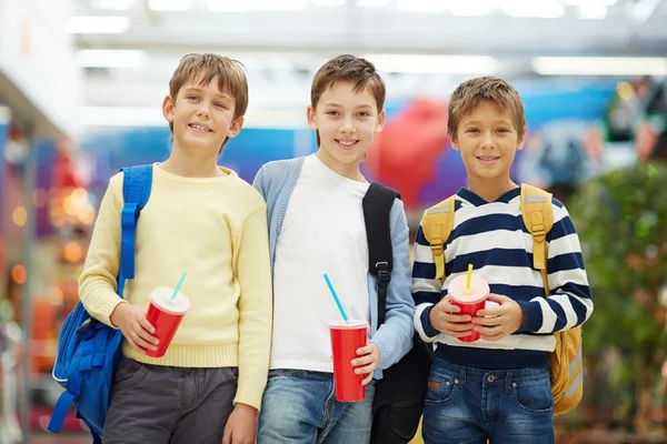 Schoolboys with soda — Stock Photo, Image