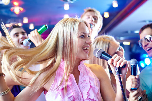 Girl singing at party