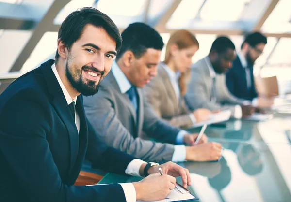 Business people listening to presentation — Stock Photo, Image