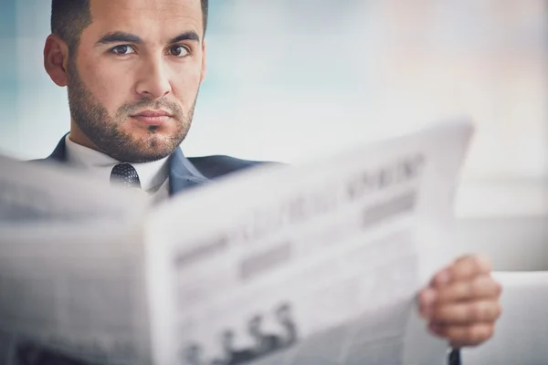 Businessman with newspaper — Stock Photo, Image