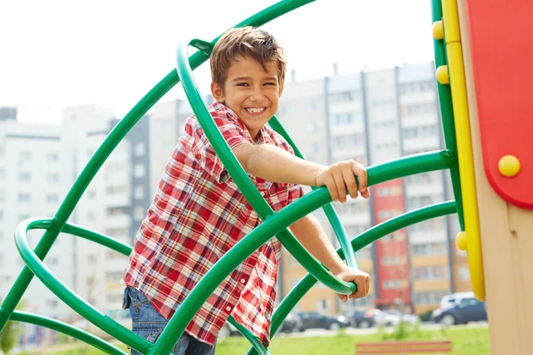 Kid having fun on playground — Stock Photo, Image