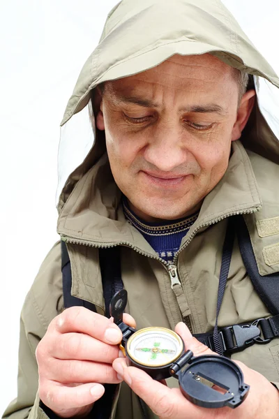 Man looking at compass — Stock Photo, Image