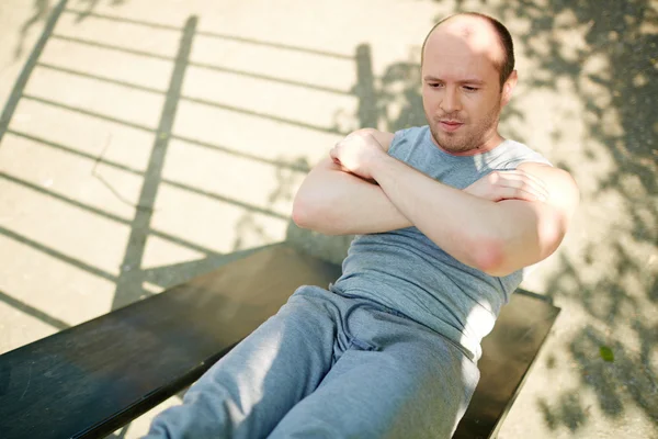 Man doing physical exercise — Stock Photo, Image