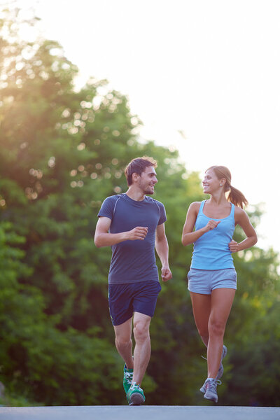 Couple running outdoors