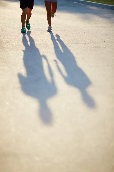 Shadows of runners — Stock Photo, Image