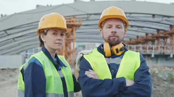 Tracking Slowmo Portrait Shot Female Male Construction Workers Safety Vests — Stock Video