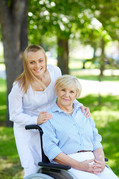 Nurse and senior patient in a wheelchair