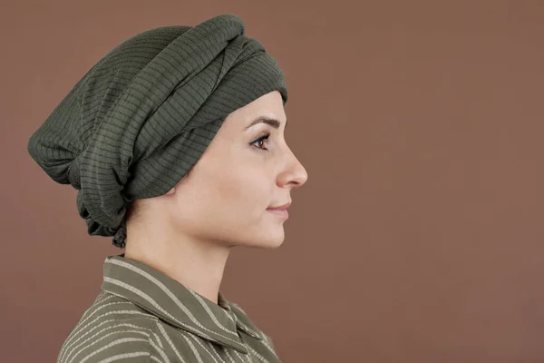Side view of young serene woman in turban and casual shirt — Stock Photo, Image