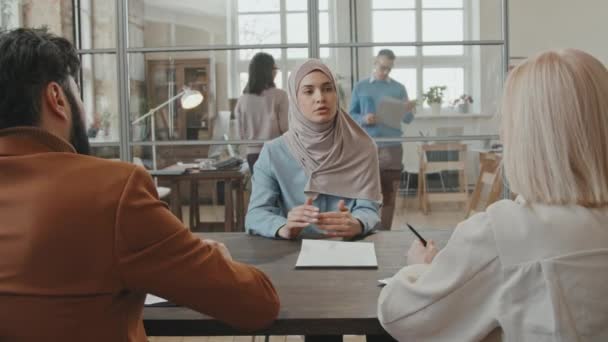 Medium Shot Representatives Talking Muslim Female Employee Telling Her She — Stock Video