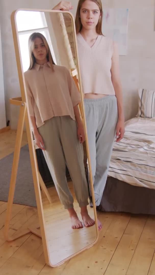 Vertical Portrait Shot Twin Sisters One Them Standing Mirror While — Stock Video