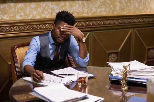 Young lawyer in formalwear looking through juridical papers — Stock Photo, Image