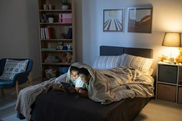 Brother And Sister Reading Fairy Tale On tablet — Stock Photo, Image