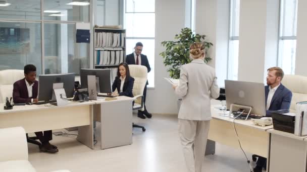 Tracking Shot Serious Female Secretary Suit Leaving Documents Desks Busy — Vídeos de Stock