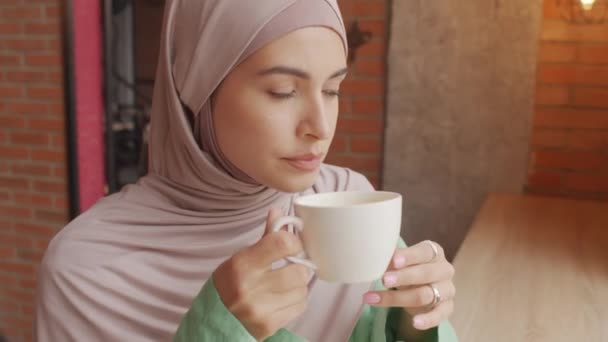 Chest Portrait Hazel Eyed Caucasian Woman Wearing Hijab Drinking Coffee – Stock-video