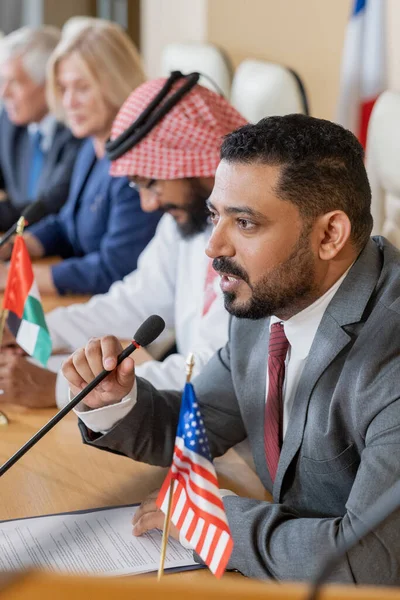 Confident mature businessman speaking in microphone — Foto Stock