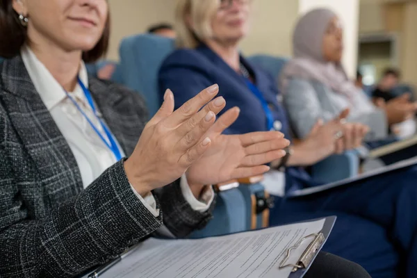 Young female delegate and her foreign colleagues clapping hands — Fotografia de Stock