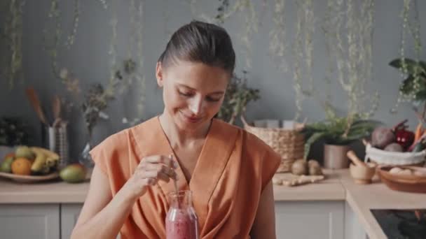 Pan Portrait Happy Young Woman Tasting Refreshing Pink Smoothie Cozy — Stock Video
