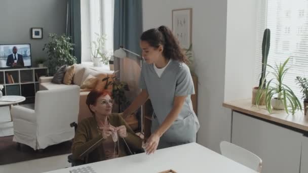 Medium Shot Red Haired Senior Woman Sitting Wheelchair Knitting Nursing — Stockvideo