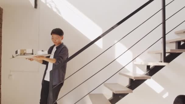 Tracking Shot Female Asian Architect Going Stairs House Layout Hands — Vídeos de Stock