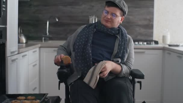 Tilting Caucasian Man Wheelchair Wearing Eyeglasses Peaked Cap Taking Out — стоковое видео