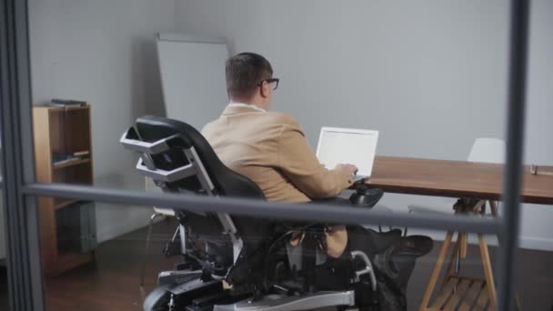 Rear View Intelligent Man Disabilities Dressed Formally Sitting Desk Office — Stock video