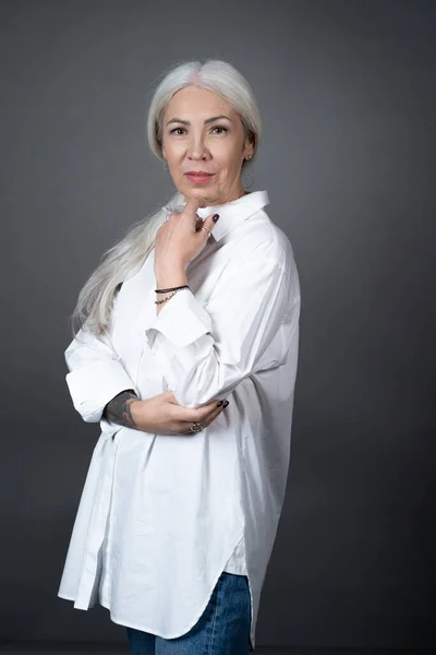 Senior woman in white blouse — Stock Photo, Image