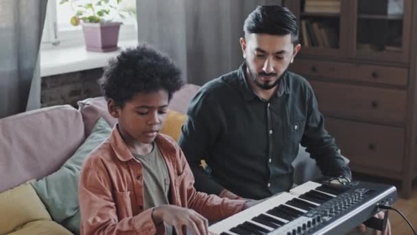 Medium Determined Little Black Boy Studying Playing Synthesizer Professional Male — Stock Video