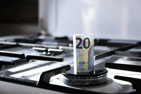 No flame. Concept of gas crisis. 20 euro bank note on a stove. Cash money. High prices of natural resources. Utility debt. Big inflation rate. Number twenty. Energy war. Saving home budget. Finance Stock Image