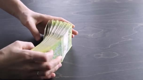 4K. Close-up view of hands wave fan out the stack of belarusian 50 ruble paper money. A lot of cash. Saving. National currency of Belarus. Pay of credit liabilities. Salary. Big debt. Tax payment — Vídeo de Stock
