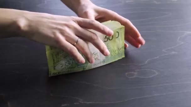 Close-up view of hands make the stack of belarusian 50 ruble paper money. Bet. I give a lot of cash. Saving. National currency of Belarus. Pay of credit liabilities. Salary. Big debt. Tax payment — Vídeo de Stock