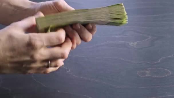 4K. Close-up view of counting stack of belarusian 50 ruble paper money. Hands hold and count a lot of cash. Saving. National currency of Belarus. Credit liabilities. Profit. Big debt. Taxes payment — Stock Video