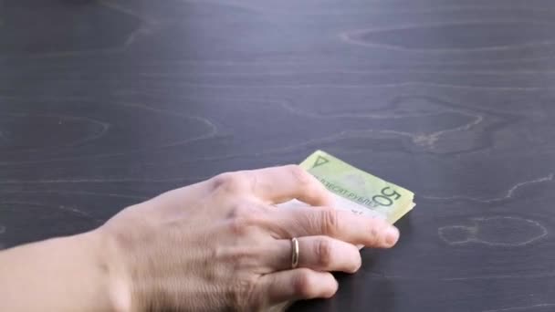 Close-up view. Move of stack of belarusian 50 ruble paper money. Bet. Hands hold a lot of cash. Saving. National currency of Belarus. Pay of credit liabilities. Salary concept. Big debt. Tax payment — Vídeo de Stock