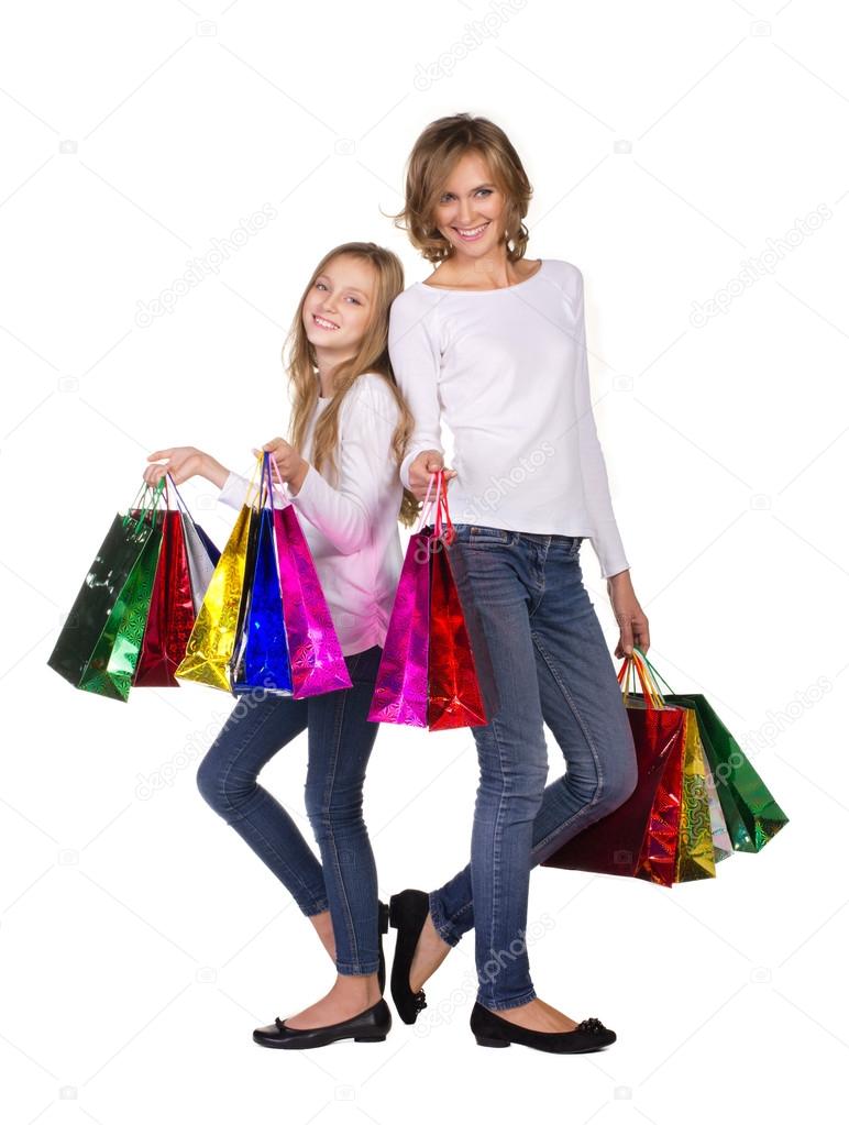mother and daughter with many bags