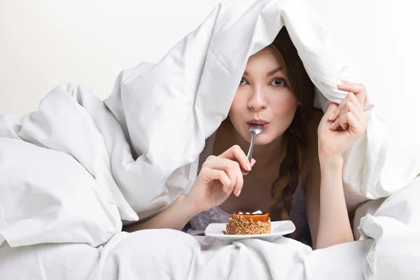 Young girl on diet eating spoon — Stock Photo, Image