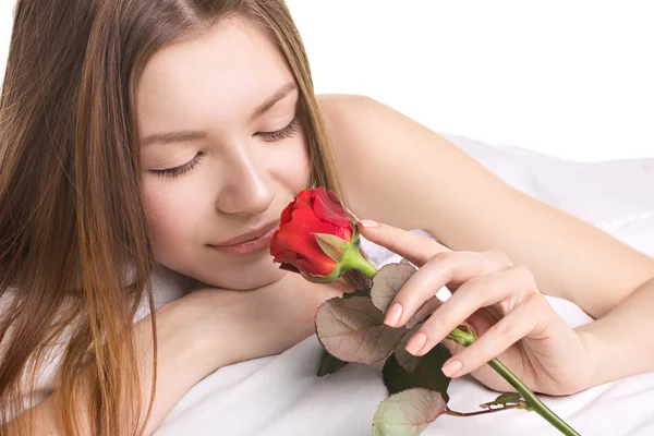 Jonge vrouw met roos — Stockfoto