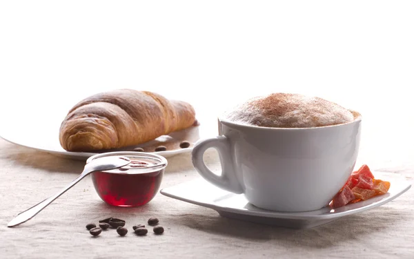 Coffee with cream and croissant — Stock Photo, Image