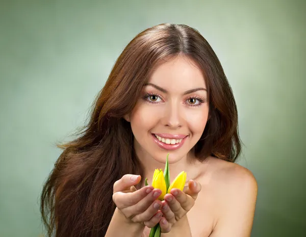 Beautiful young women with tulip — Stock Photo, Image
