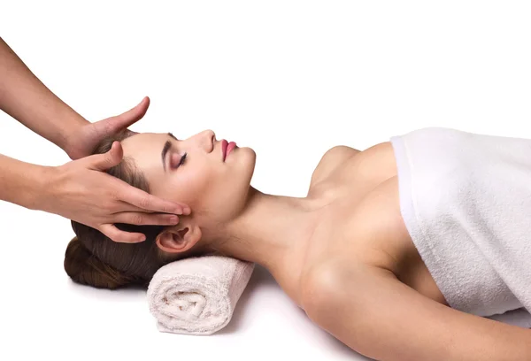 Young woman receiving facial massage — Stock Photo, Image