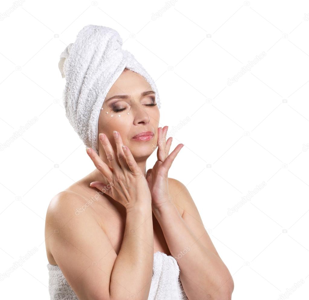 woman applying cream for face