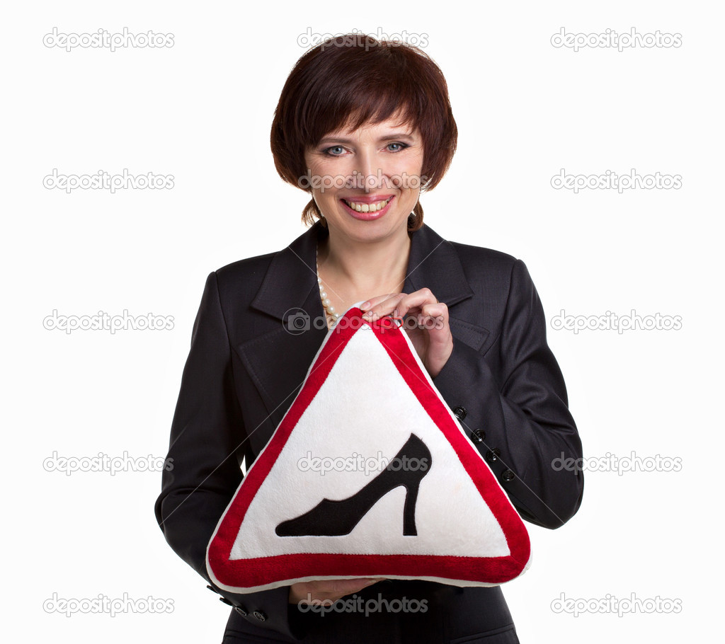 Mature woman with road sign