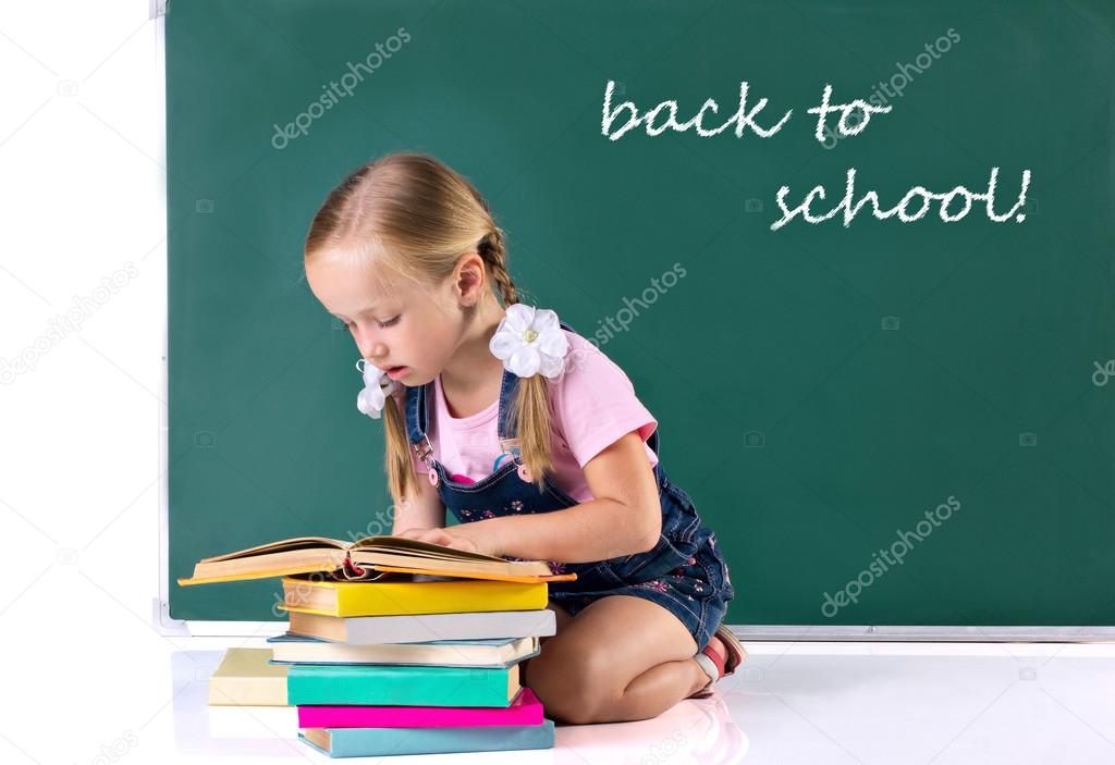 little girl reading book