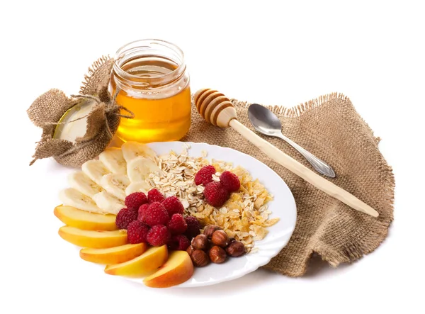 Bodegón con miel, frutos secos y copos — Foto de Stock