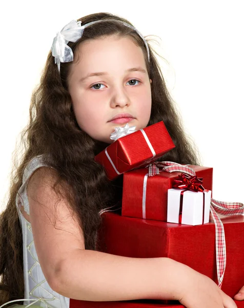 Sadnessed girl with presents Royalty Free Stock Images