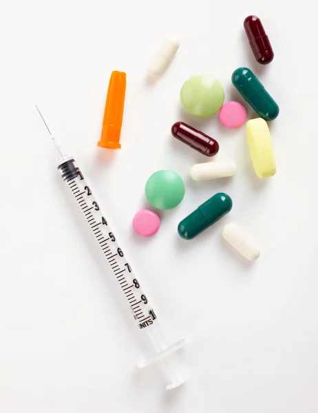 Insulin syringe and colorful medicaments — Stock Photo, Image