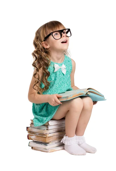 Girl  in big  glass and books — Stock Photo, Image