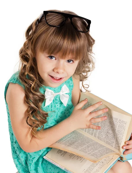 Preschooler girl with book — Stock Photo, Image