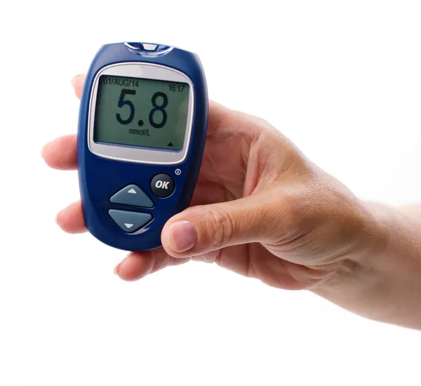 Glucometer in woman's  hand — Stock Photo, Image