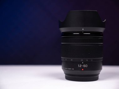 Zoom lens with extended front lens on a white background top view