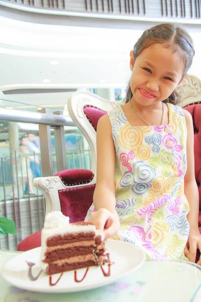 Girl and chocolate cake — Stock Photo, Image